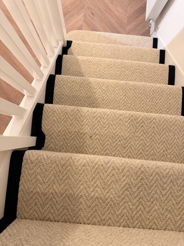Herringbone stair runner viewed from above fitted by DL Carpets and Flooring