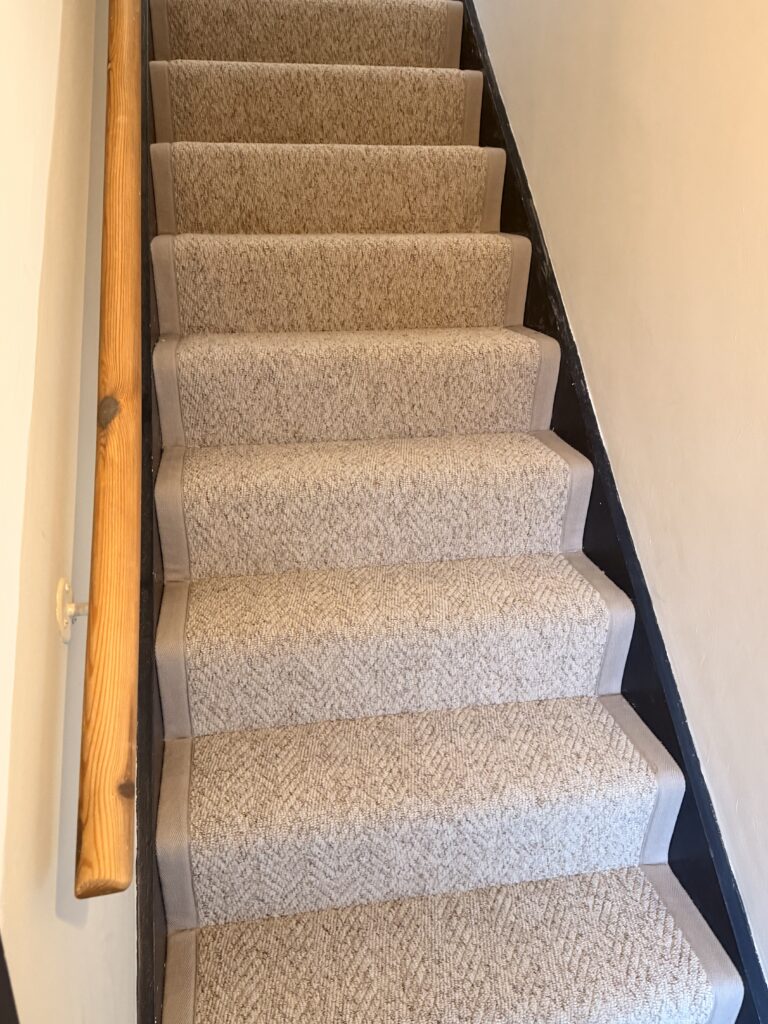 Neutral stair runner with grey binding fitted by DL Carpets and Flooring